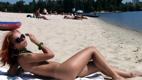 Skinny young nudist babes enjoy a sunny day at the beach